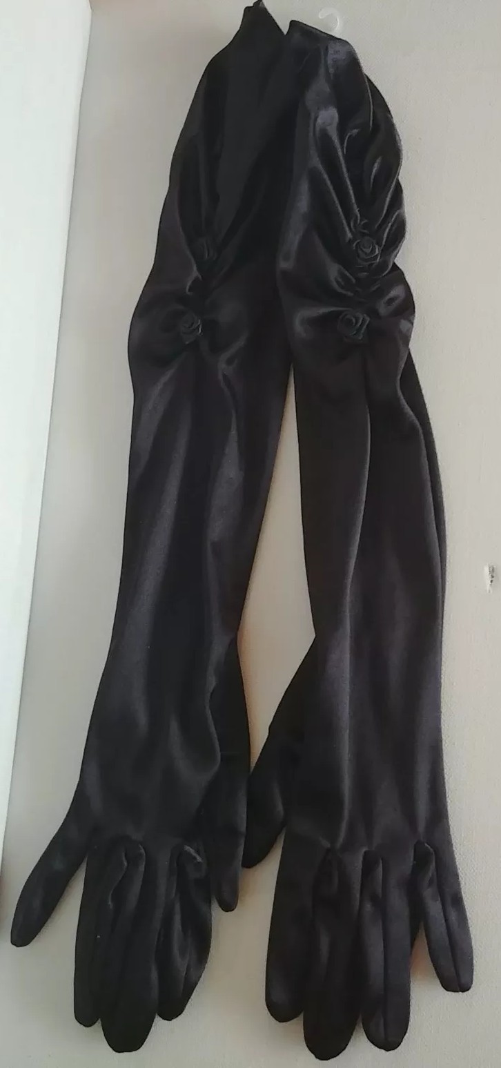 Ladies Elbow Length Black Gloves. 90% Nylon, 10% Spandex. W/Black Rose Design.