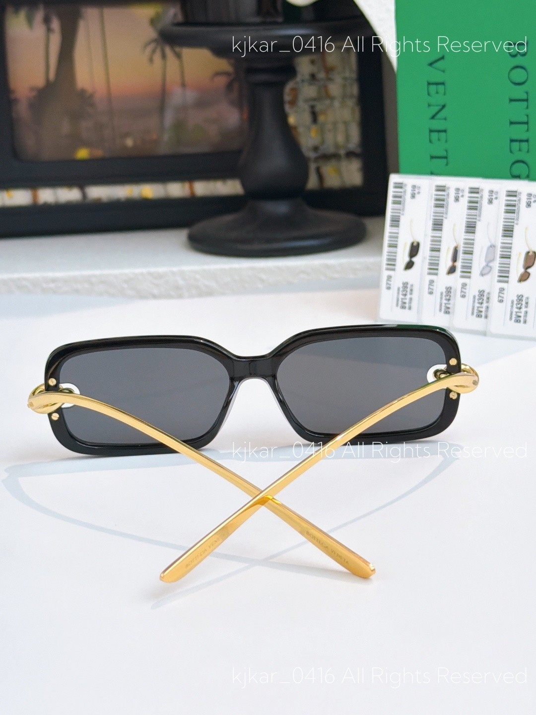Bottega Veneta BV1439S Women’s Sunglasses Black Frame Gold Knot Gray Lenses